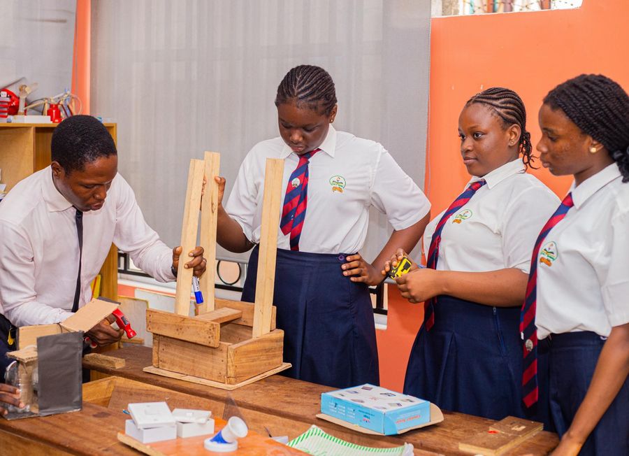 College students building a wooden project in the technology workshop